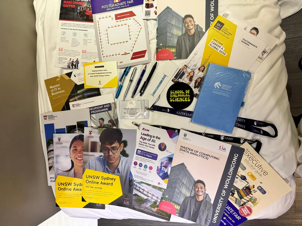 Programme brochures and event materials collected at the fair.